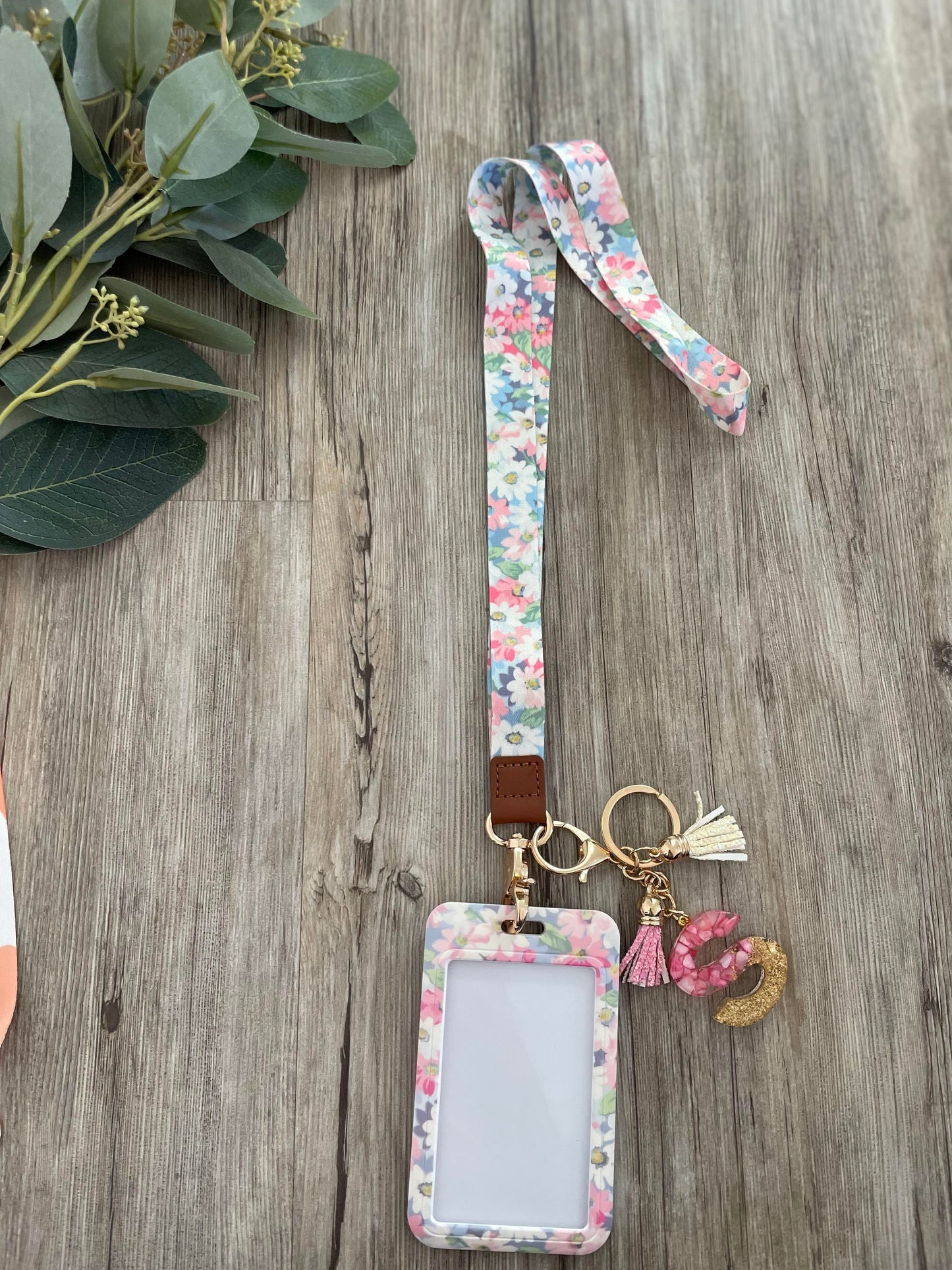 Flower Lanyard which includes a ID Card holder to keep your identity safe. Personalise with a range of accessories. 