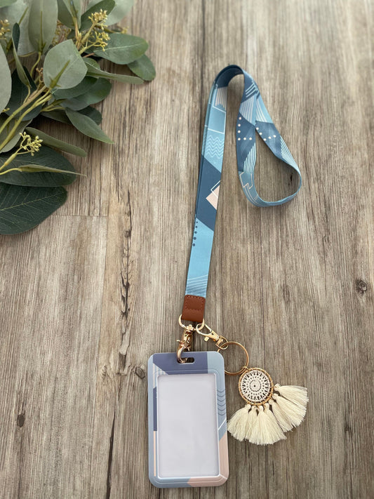 Lanyard with blue geometric tones and ID card holder. 